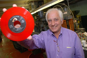 Chris Ashworth of United Record Pressing holding a 45