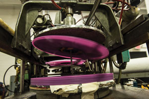 Stack of purple records on a machine