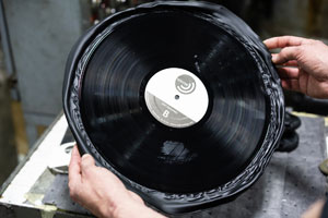 URP employee examines test pressing