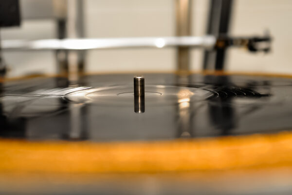 Close-up of lacquer disc on a lathe machine with blurry effect applied to it