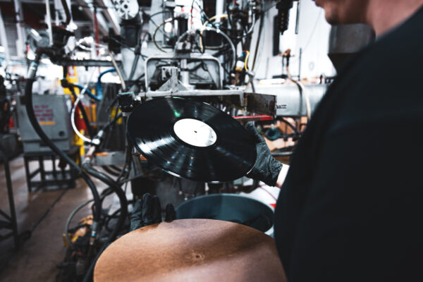 Employee looking at pressed record