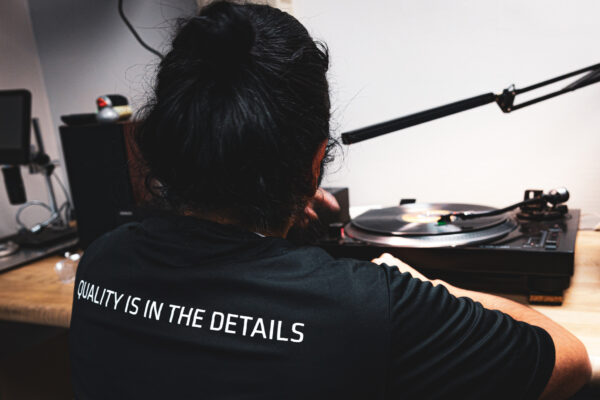 Worker listening to vinyl record