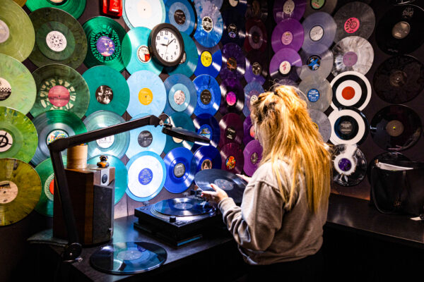 Worker looking at pressed record