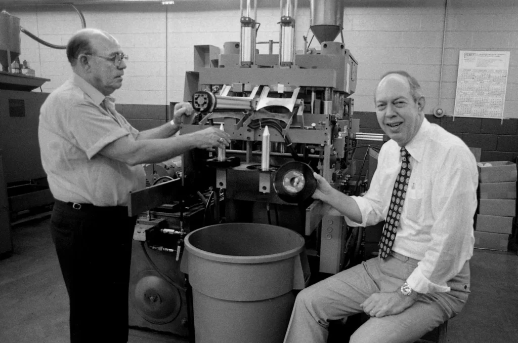 Black and white photograph of John Dunn and Ozell Simpkins at the historic United Record Pressing plant